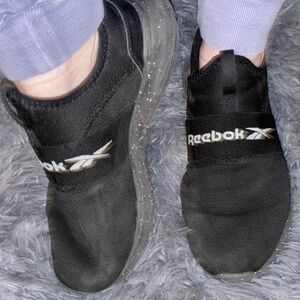 Well worn workout Reebok women’s black shoes